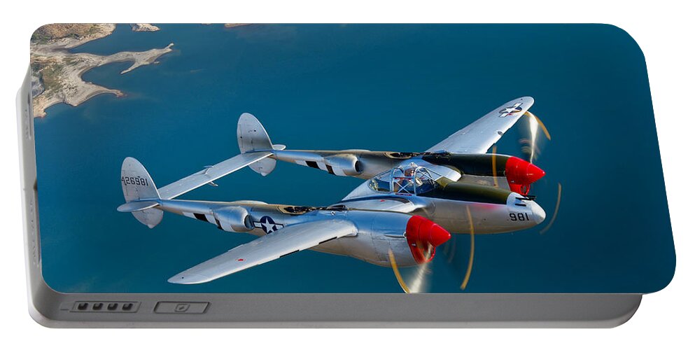 World War Ii Portable Battery Charger featuring the photograph A Lockheed P-38 Lightning Fighter by Scott Germain