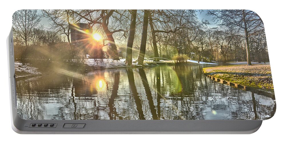 Sun Portable Battery Charger featuring the photograph A Pond in Rotterdam by Frans Blok