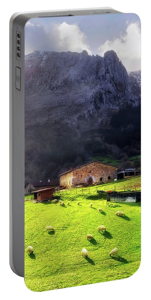 House Portable Battery Charger featuring the photograph A typical basque country farmhouse with sheep by Mikel Martinez de Osaba