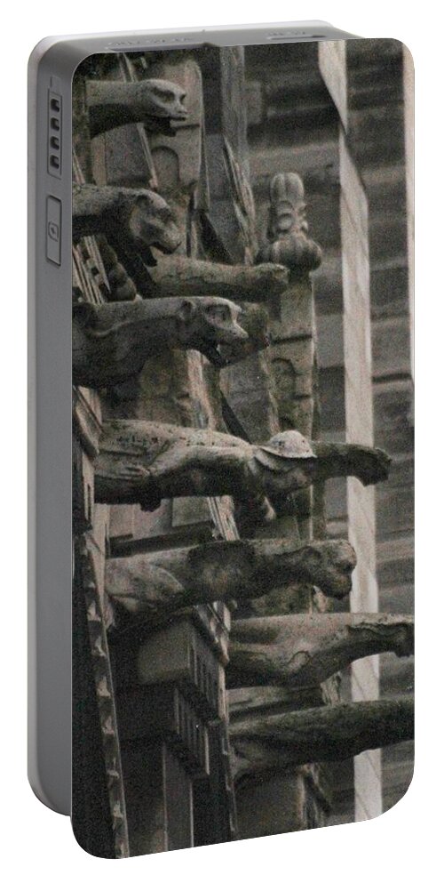 Gargoyles Portable Battery Charger featuring the photograph A Wall of Gargoyles Notre dame cathedral by Christopher J Kirby