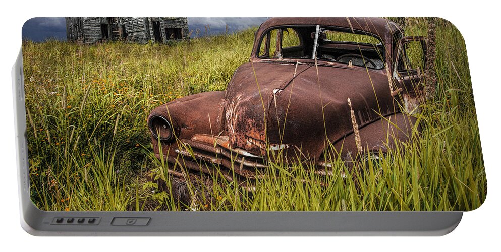 Automobile Portable Battery Charger featuring the photograph Abandoned Vintage Car and Farm Homestead by Randall Nyhof