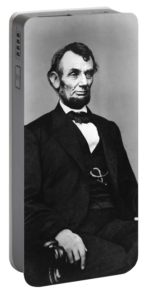 abraham Lincoln Portable Battery Charger featuring the photograph Abraham Lincoln portrait - used for the five dollar bill - c 1864 by International Images