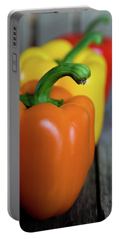 Green Portable Battery Charger featuring the photograph Array of Peppers by Deborah Klubertanz