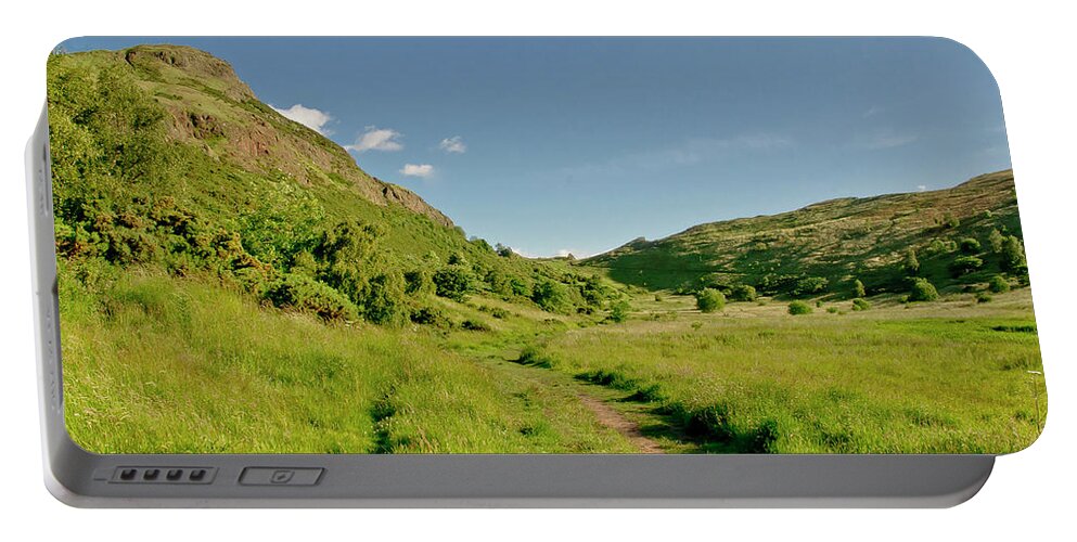 Edinburgh Portable Battery Charger featuring the photograph At the base of the ancient volcano. by Elena Perelman