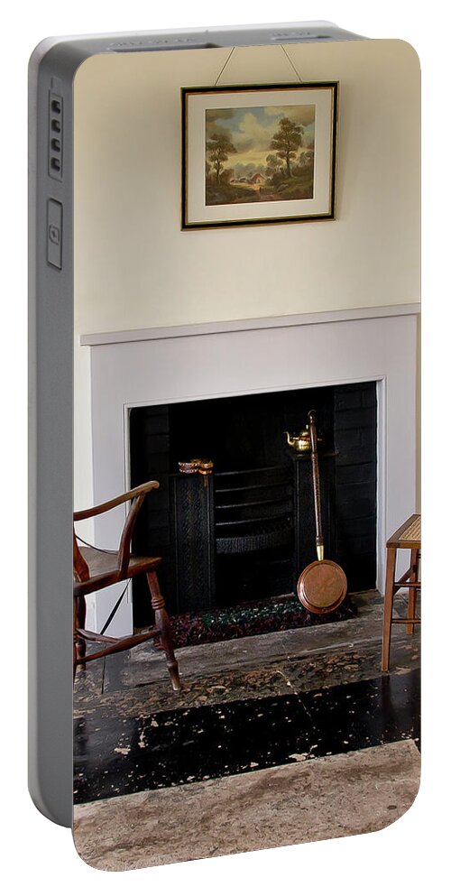 Fireplace Portable Battery Charger featuring the photograph At the cold fireplace. by Elena Perelman
