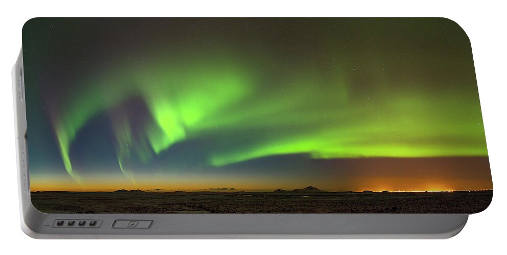 Iceland Portable Battery Charger featuring the photograph Aurora above Keflavik in Iceland. by Andy Astbury