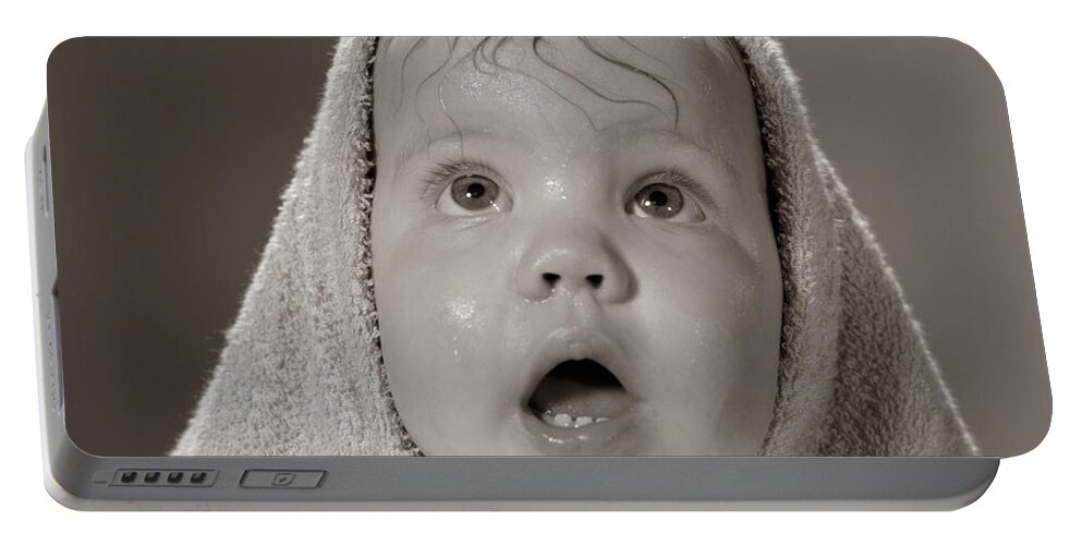 1960s Portable Battery Charger featuring the photograph Baby In Towel, C.1960s by H. Armstrong Roberts/ClassicStock