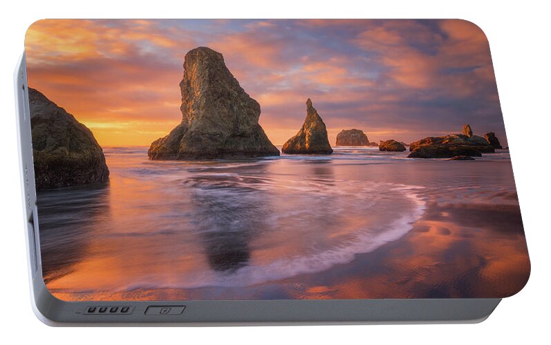 Sunset Portable Battery Charger featuring the photograph Bandon's New Years Eve Light Show by Darren White