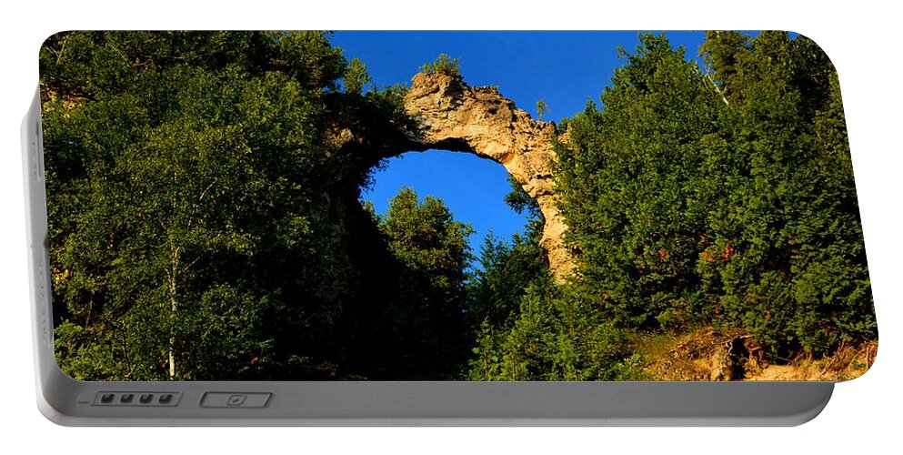 Mackinac Island Portable Battery Charger featuring the photograph Beneath Arch Rock by Keith Stokes