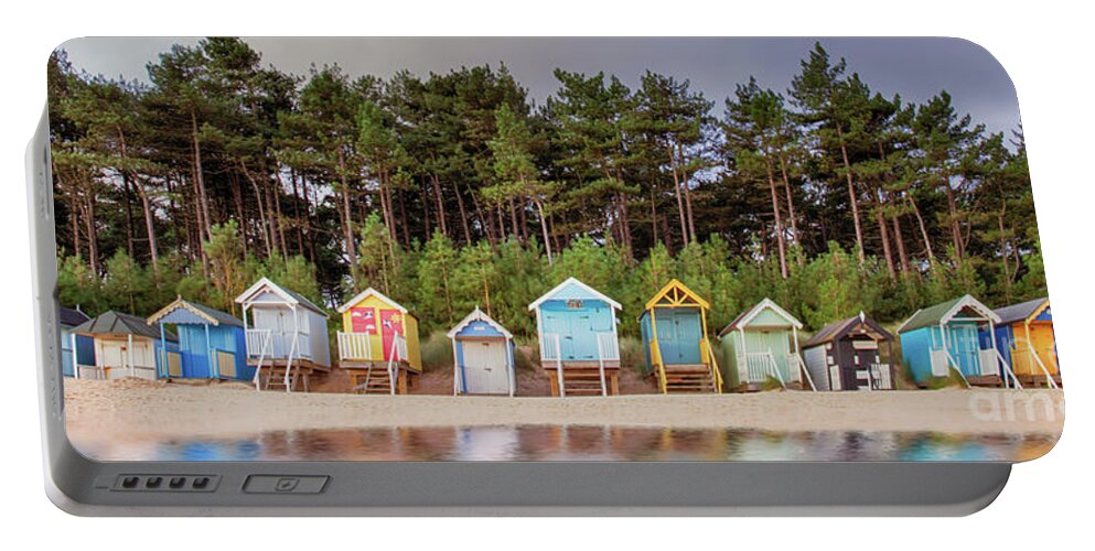 Wells Portable Battery Charger featuring the photograph Beach hut row on the Norfolk coast by Simon Bratt