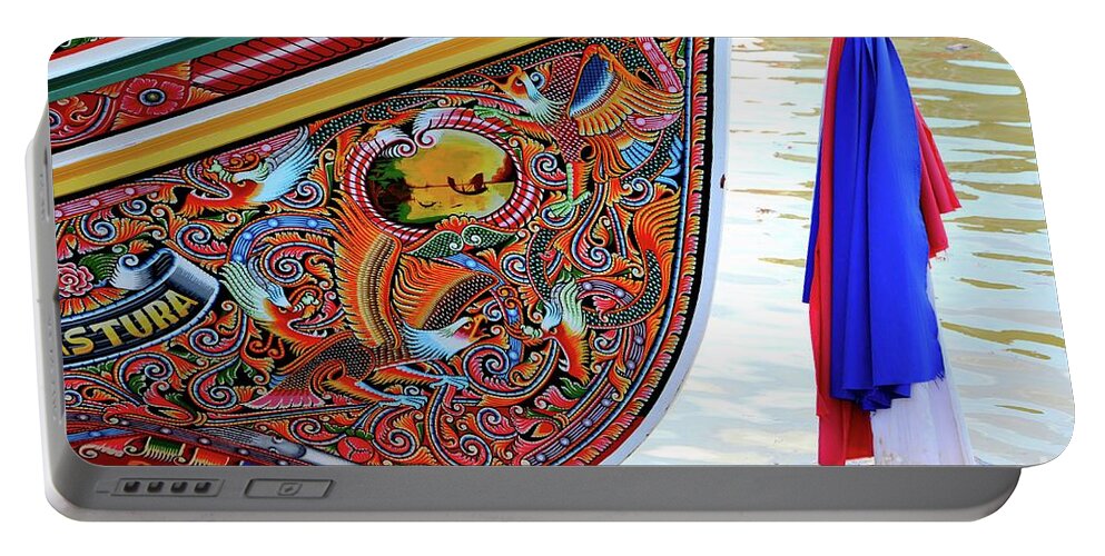 Boat Portable Battery Charger featuring the photograph Beautiful painted Asian dragon and floral art on hull of Thai fishing boat Pattani Thailand by Imran Ahmed