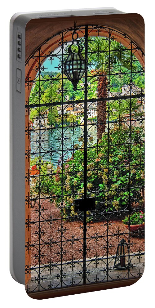 Wrought-iron Portable Battery Charger featuring the photograph Behind the Wrought-Iron Door by Hanny Heim