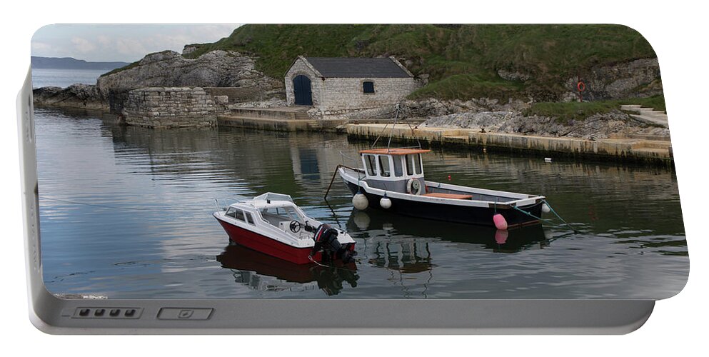 Fishing Village Portable Battery Charger featuring the photograph Boats in Ballintoy Harbor by Teresa Wilson