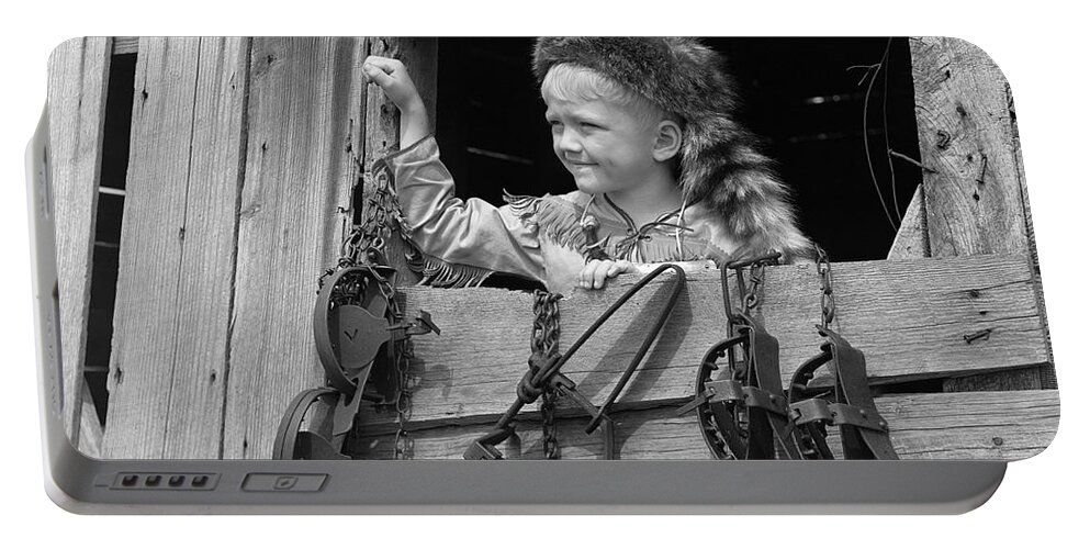 1950s Portable Battery Charger featuring the photograph Boy In Coonskin Cap, C.1950s by D. Corson/ClassicStock