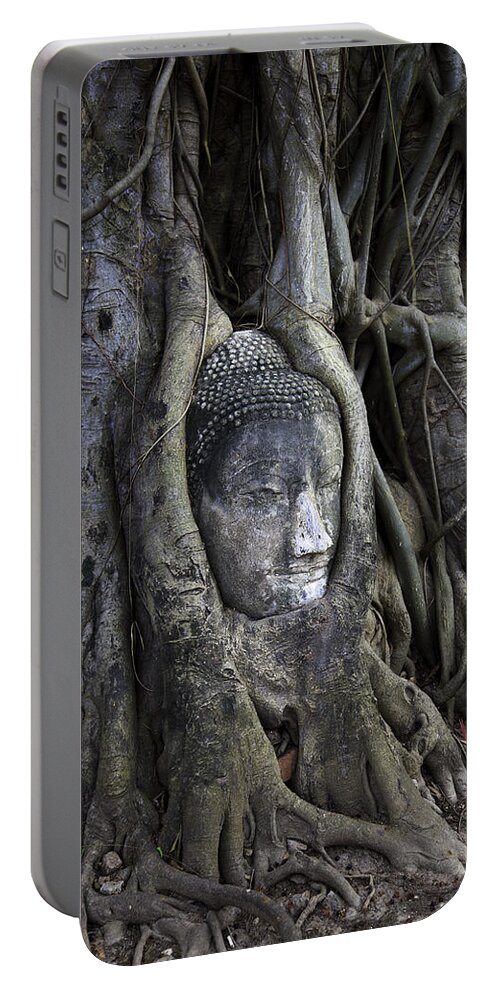 Buddha Head In Tree Portable Battery Charger featuring the photograph Buddha Head in Tree by Adrian Evans