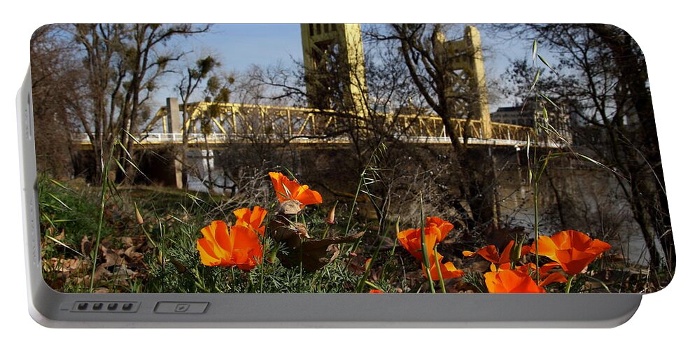 Landscape Portable Battery Charger featuring the photograph California Poppies With The Slightly Photographically Blurred Sacramento Tower Bridge In The Back by Wingsdomain Art and Photography