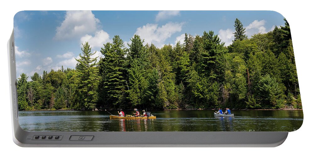 Canoe Portable Battery Charger featuring the photograph Canoe paddling in Algonquin Park by Les Palenik
