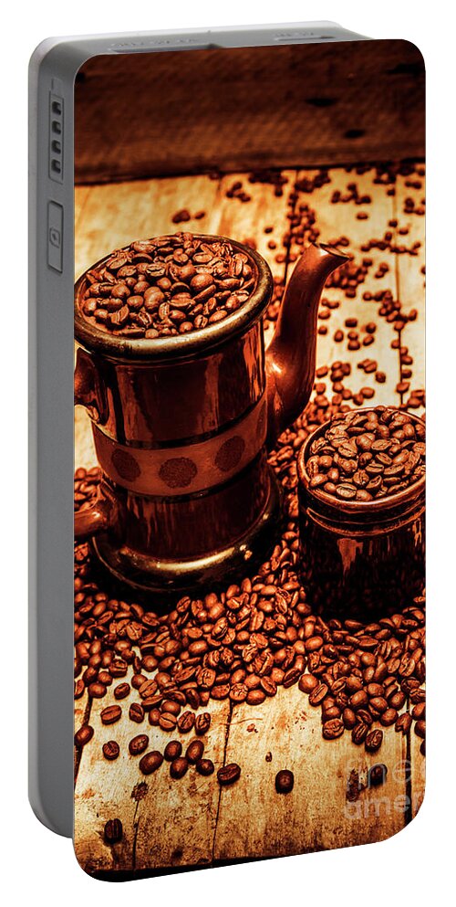 Hot Portable Battery Charger featuring the photograph Ceramic coffee pot and mug overflowing with beans by Jorgo Photography
