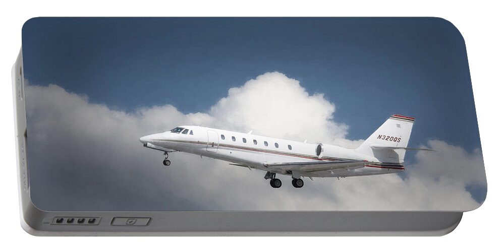 Aviation Portable Battery Charger featuring the photograph Cessna 680 by Guy Whiteley
