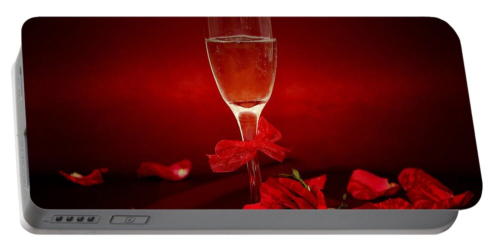Alcohol Portable Battery Charger featuring the photograph Champagne Glass With Red Roses And Petals by Serena King