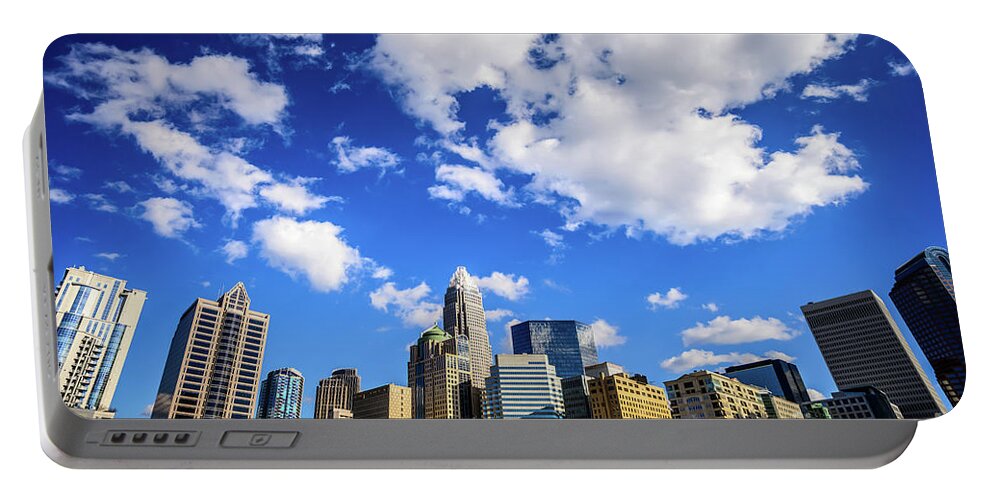 121 West Trade Portable Battery Charger featuring the photograph Charlotte Skyline Blue Sky and Clouds by Paul Velgos