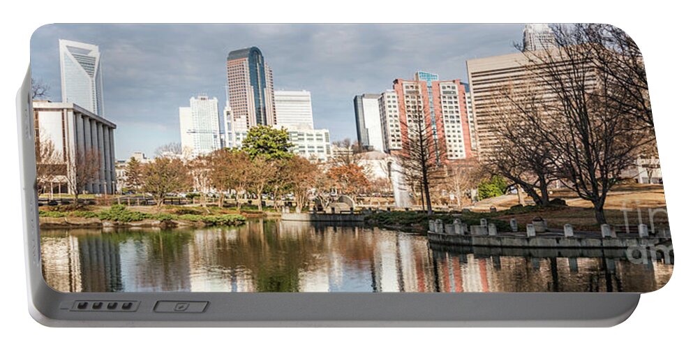 America Portable Battery Charger featuring the photograph Charlotte Skyline Panorama at Marshall Park Pond by Paul Velgos