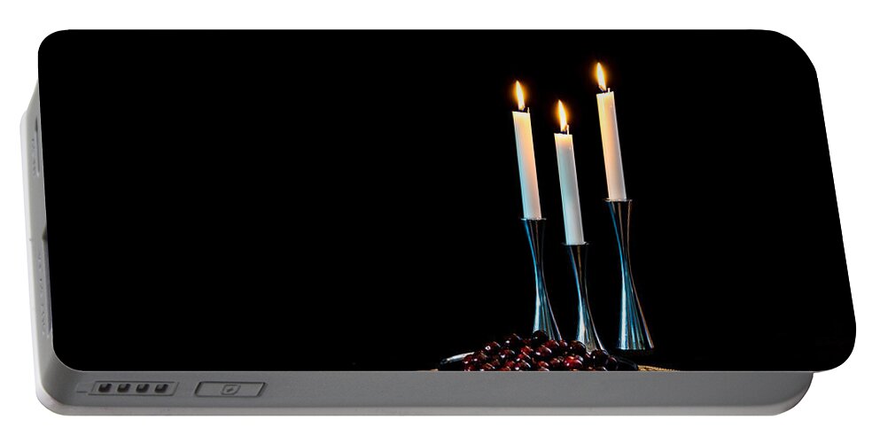 Cherries And Candles In Steel Portable Battery Charger featuring the photograph Cherries and candles in steel by Torbjorn Swenelius