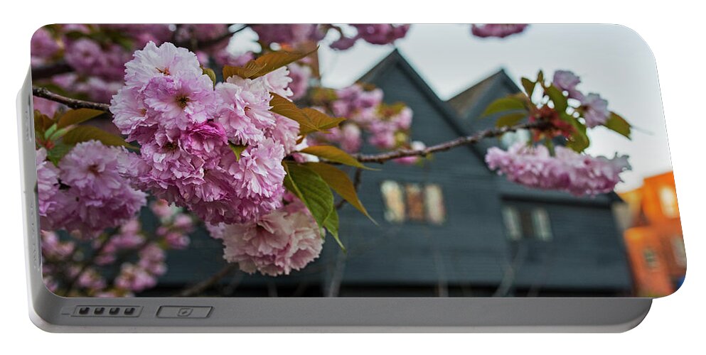 Salem Portable Battery Charger featuring the photograph Cherry Blossoms in front of the Salem Witch House Salem MA by Toby McGuire