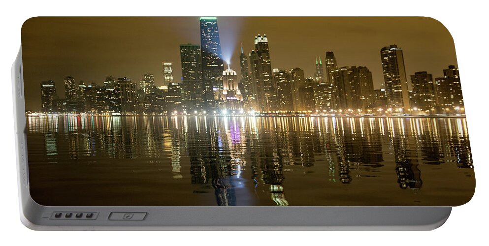 Architecture Portable Battery Charger featuring the photograph Chicago Skyline with Lindbergh Beacon on Palmolive Building by Peter Ciro