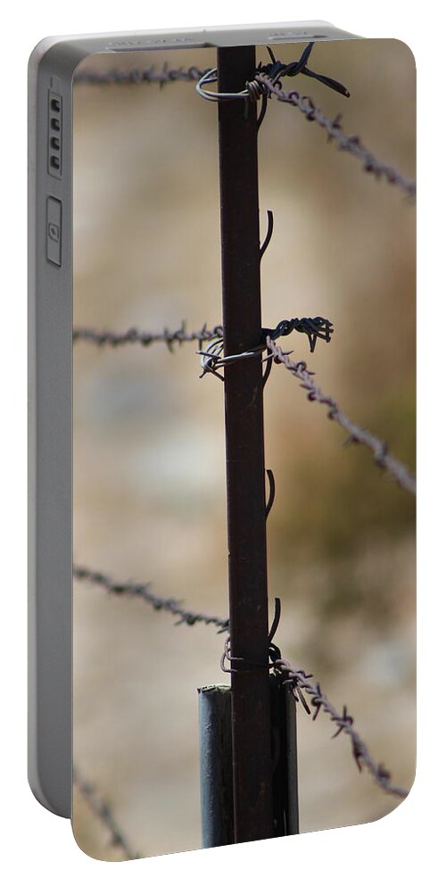 Golden Portable Battery Charger featuring the photograph Closeup of Barbed Wire Fence - Portrait 2 by Colleen Cornelius