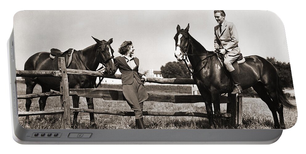 1930s Portable Battery Charger featuring the photograph Couple Out Riding, C.1930-40s by H Armstrong Roberts and ClassicStock