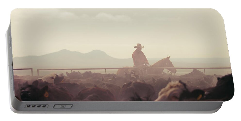 Quarter Portable Battery Charger featuring the photograph Cowboy Dawn by Todd Klassy