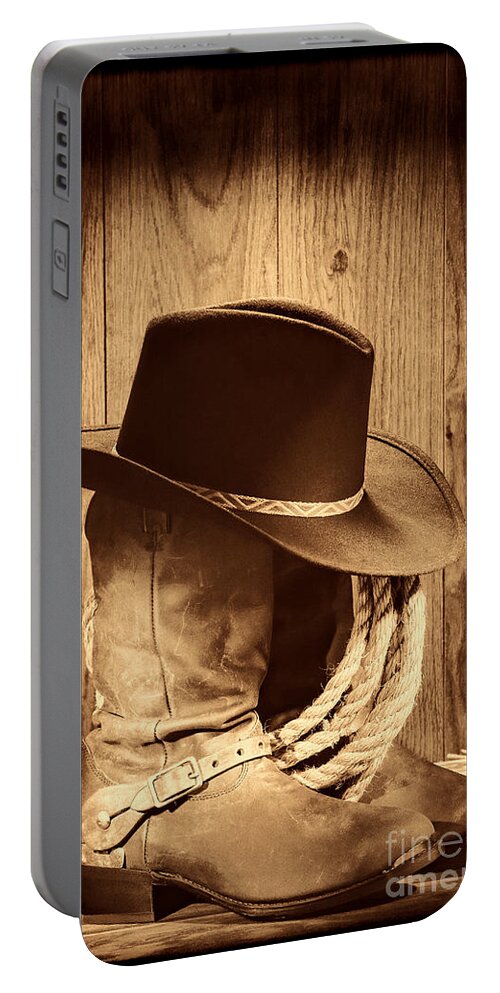 Antique Portable Battery Charger featuring the photograph Cowboy Hat on Boots by American West Legend By Olivier Le Queinec