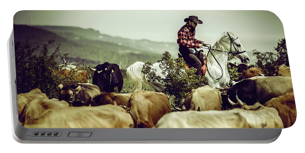 Horse Portable Battery Charger featuring the photograph Cowboy on cattle round by Dimitar Hristov