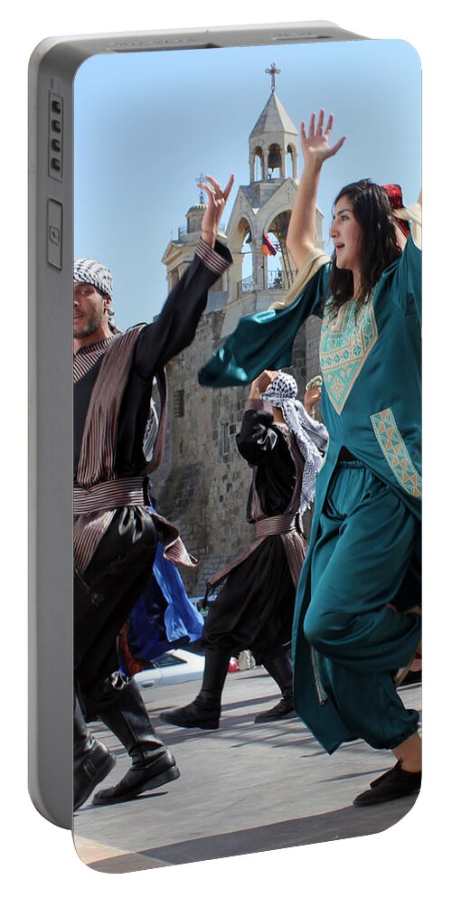 Olive Portable Battery Charger featuring the photograph Dancing near Nativity Church by Munir Alawi