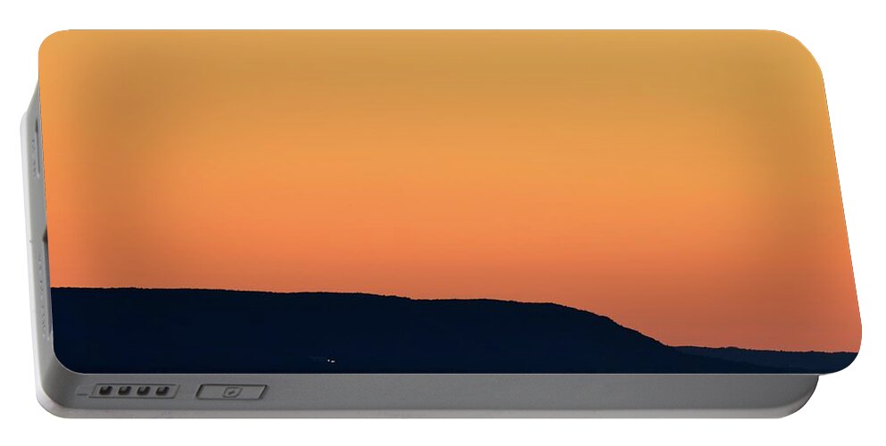 Abstract Portable Battery Charger featuring the photograph Distant Blue Mountain At Sunset by Lyle Crump