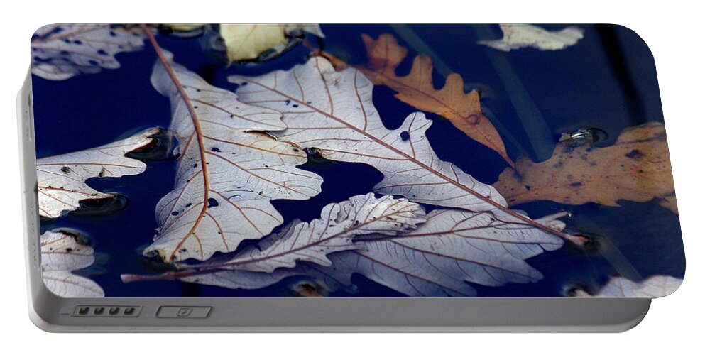 Leaf Portable Battery Charger featuring the photograph Drowning in indigo by Doris Potter