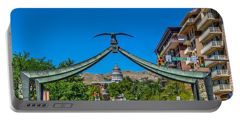 Arch Portable Battery Charger featuring the photograph Eagle Gate Monument by Paul LeSage
