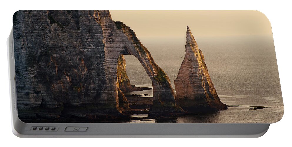 Sea Portable Battery Charger featuring the photograph Etretat in morning sun by Jaroslaw Blaminsky