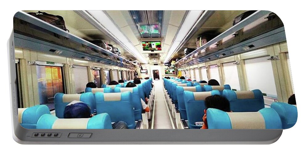 Wanderlust Portable Battery Charger featuring the photograph Perspective Inside A Train by Kelly Santana