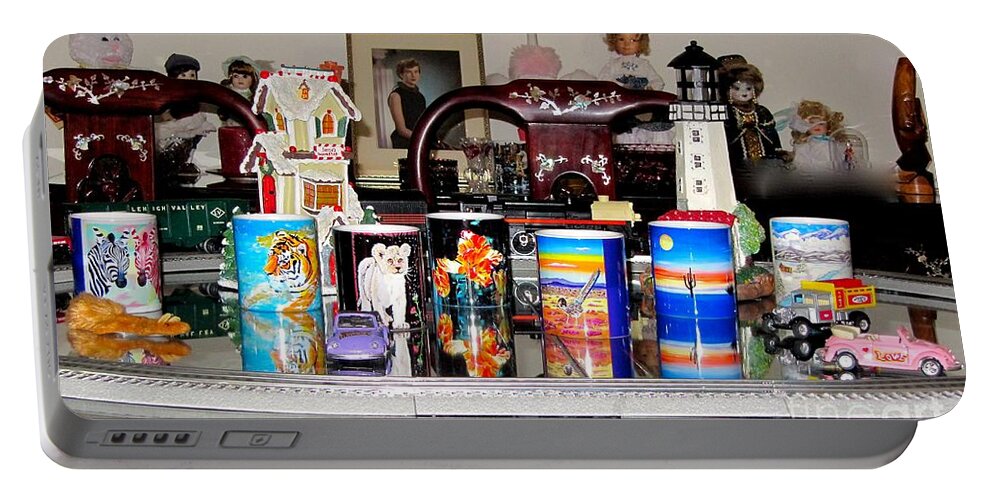 Faa Mugs Portable Battery Charger featuring the photograph FAA Mugs Train and Toys in Background by Phyllis Kaltenbach