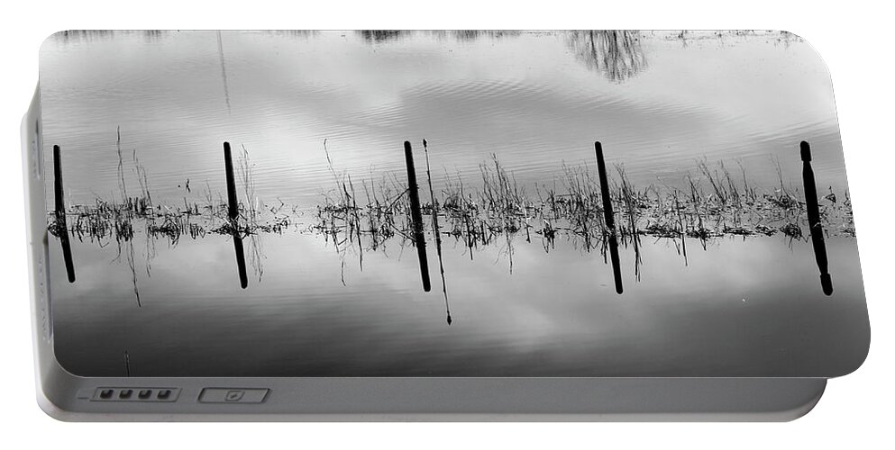 Flood Fence Water Monochrome Portable Battery Charger featuring the photograph Flooded Fence by Ian Sanders