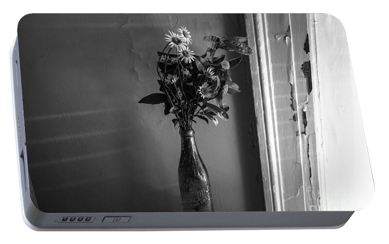 Flowers Portable Battery Charger featuring the photograph Flowers in a peculiar vase by Taylor McLaurin