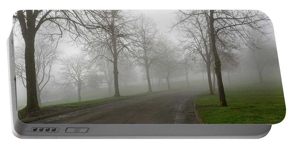 Fog Portable Battery Charger featuring the photograph Foggy Morning at the Park Winding Path by David Gn