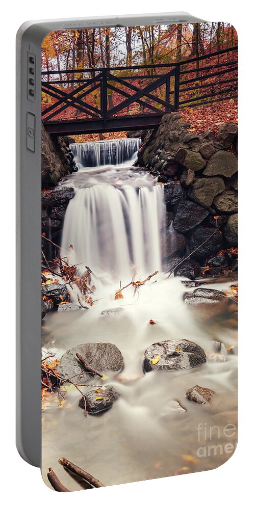 Autumn Portable Battery Charger featuring the photograph Forest waterfall by foot bridge by Sophie McAulay