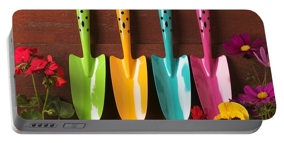 Trowel Portable Battery Charger featuring the photograph Four colored trowels by Garry Gay