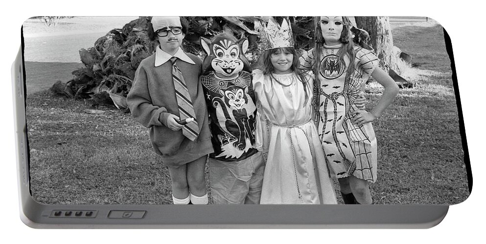 Halloween Portable Battery Charger featuring the photograph Four Girls in Halloween Costumes, 1971, Part One by Jeremy Butler