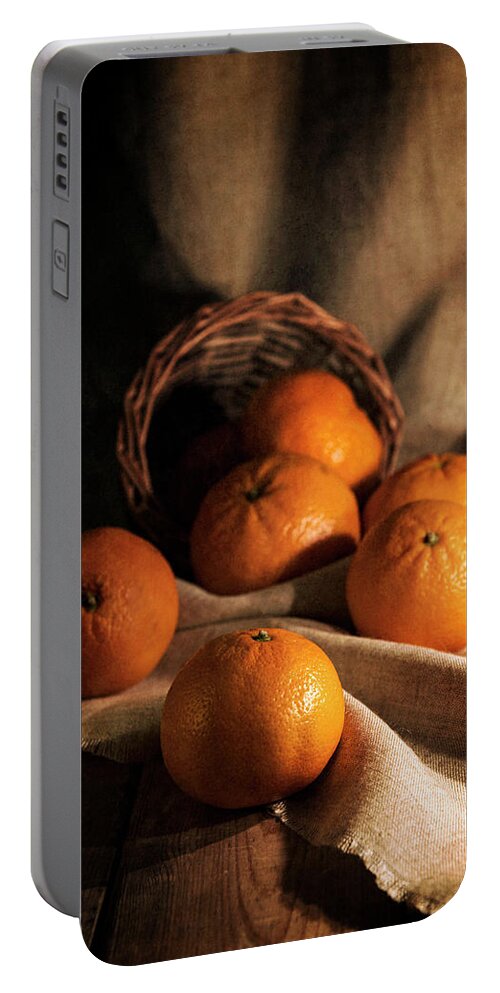 Basket Portable Battery Charger featuring the photograph Fresh tangerines in brown basket by Jaroslaw Blaminsky