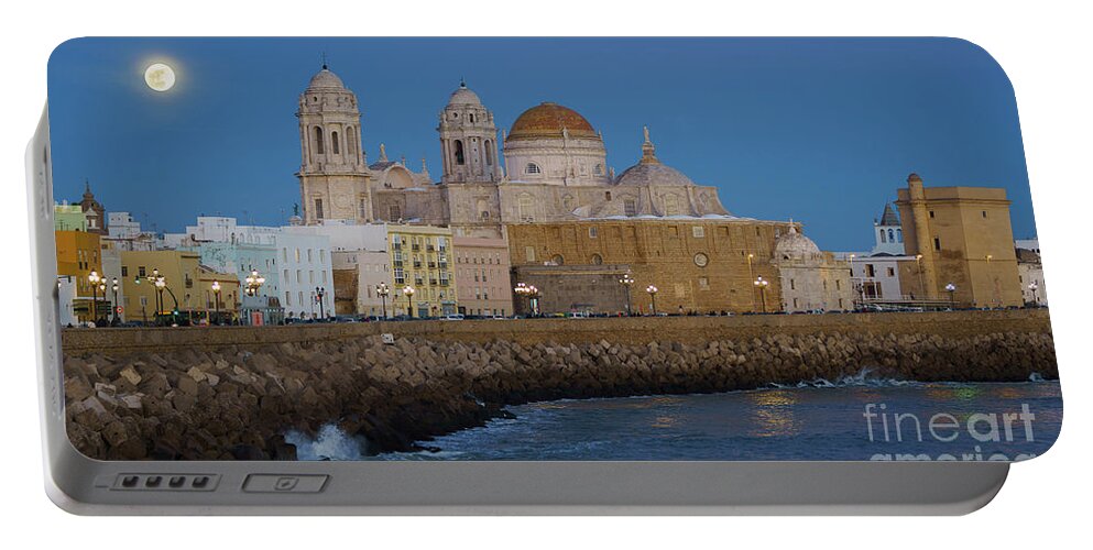 Tour Tourism Portable Battery Charger featuring the photograph Full Moonrise Over the Cathedral Cadiz Spain by Pablo Avanzini