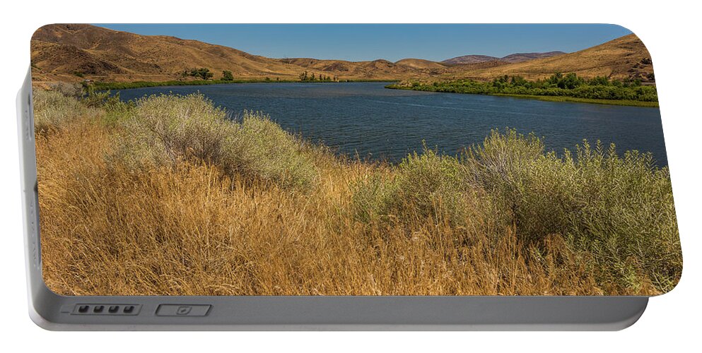 Snake River Portable Battery Charger featuring the photograph Golden Grasses along the Snake River by Brenda Jacobs